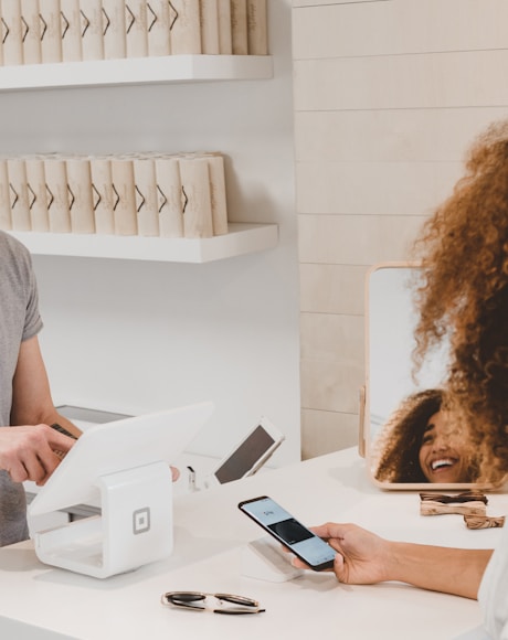 Happy florist using Tech Floral software on tablet